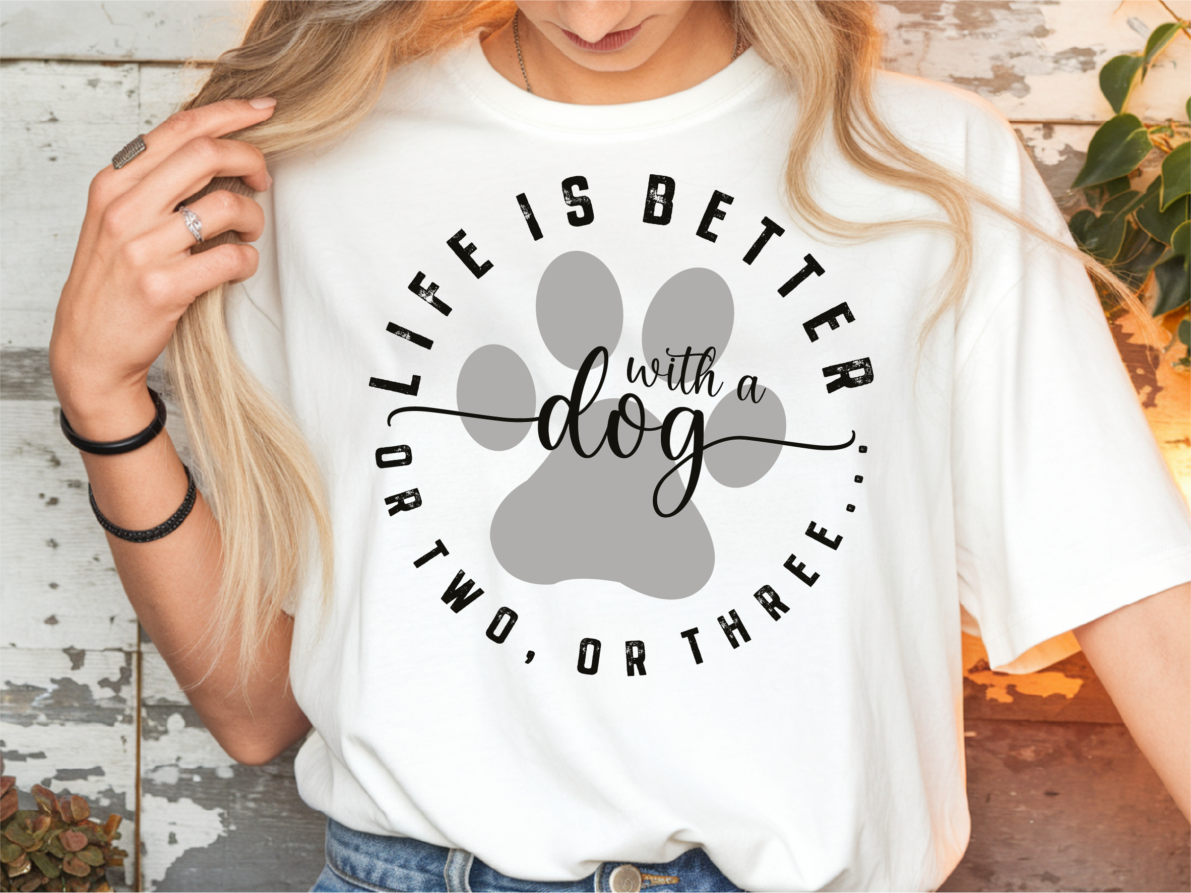T-Shirt – „Life is better with a dog or two, or three"